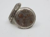 an image of a silver pocket watch on a white surface