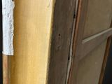 an image of a close up of a wooden door with a sticker on it