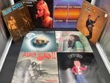 a lot of vinyl records on display on a table