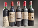 six bottles of wine are lined up in a row on a table