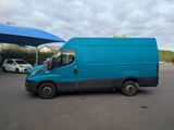 a blue van that is parked in a parking lot