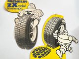 two stickers of a cartoon character on a car tire