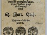 un vieux papier sur lequel figurent trois symboles différents