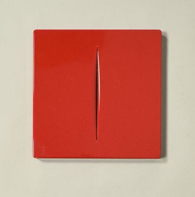 a red square with a needle sticking out of it