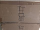 a cardboard box sitting on top of a refrigerator door
