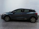 the grey car is parked on the concrete floor in the room