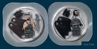 batman and catwoman minifigurs in a plastic mold