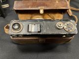 an old camera that is sitting on a table