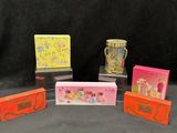 four small cards with different designs on them sitting on a table