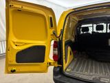 a yellow van with the door open and the back door open