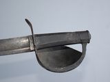 a close up of a metal object with a knife in it