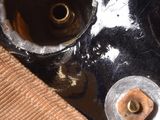 a close up view of a sink with a rusted faucet