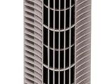 a silver and black tower fan sitting on top of a table