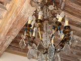 a chandelier hanging from the ceiling in a room