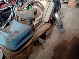 a scooter that is parked in a garage