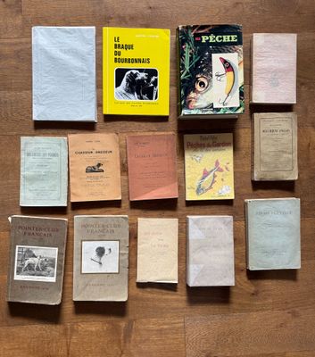 books on a wooden table with a variety of covers on them