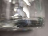 a close up picture of a glass jar with water in it