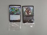 two cards that are sitting on a table
