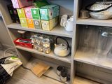 a shelf with various items on it in a room