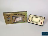 a small electronic device that is sitting next to a box