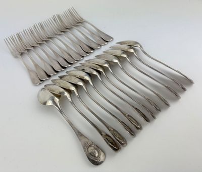 a lot of forks and spoons sitting on a table