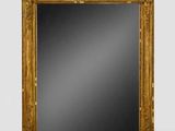 an antique gold framed mirror on a white background