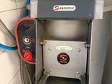 a machine that is sitting on a shelf in a room