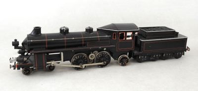 a toy train that is sitting on a white surface