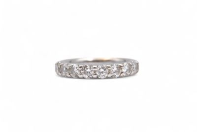 a close up of a diamond ring on a white background