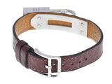 the brown leather bracelet has a silver buckle on the clasp
