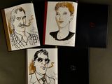 three drawings of a man and a woman are on a table