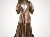a bronze statue of a woman in a dress and hat