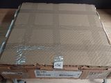 a cardboard box sitting on top of a wooden table