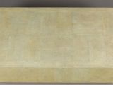 a beige box sitting on top of a white table
