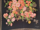 an image of a black scarf with a bunch of flowers on it