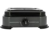 un gros plan d'une mijoteuse noire sur fond blanc