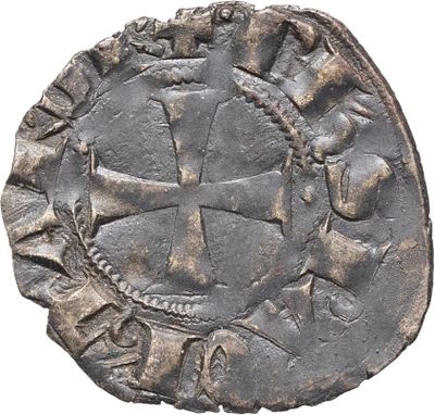 une pièce d'argent sur laquelle est gravée une croix