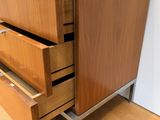 an image of a wooden dresser with four drawers