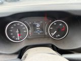 a close up of a car dashboard with a speedometer and gauges