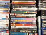 many dvds stacked on top of each other in a box