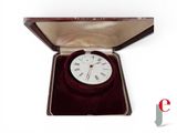 a white clock in a red case on a white background