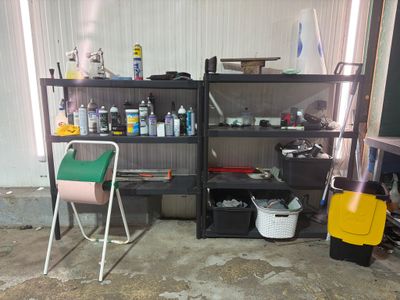 a room with a shelf and a chair in it