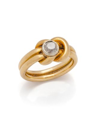 an image of a gold ring with a white diamond