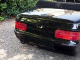 a black sports car parked on the side of the road