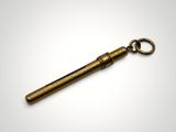 an old brass telescope keychain on a white background