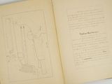 an open book with a drawing on it on a table