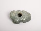 an image of a stone object with a hole in the middle
