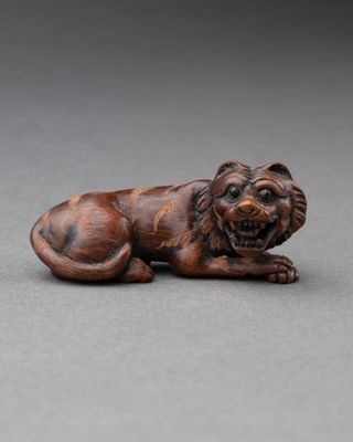 JAPON - EPoque MEIJI (1868-1912). NETSUKE, figurant un tigre…