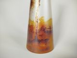 a vase that is sitting on a white surface