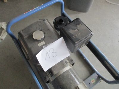 a blue cart with a pump and a sign on it